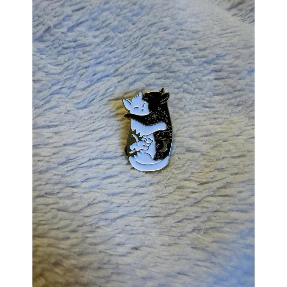 Enamel pin two cats hugging black and white, cat, yin, and yang constellation